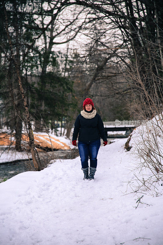 Female Wearing Knitted Scarf, Hat, Walking, Geyser Background